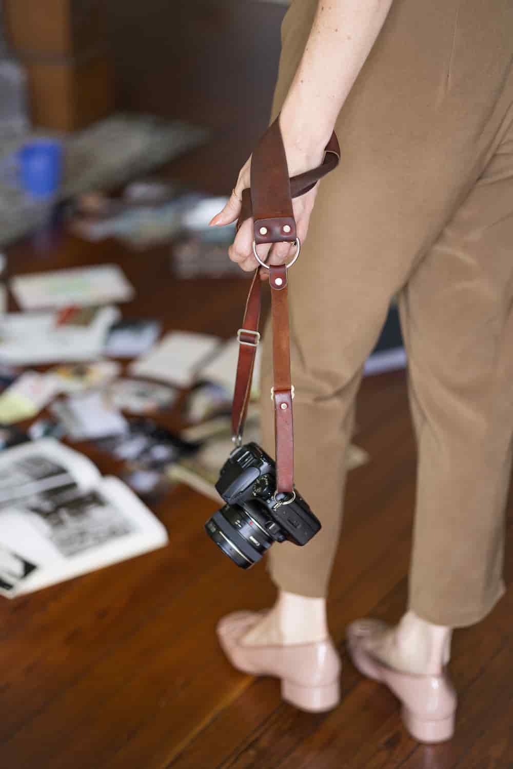 Kendall taking a photo with her 35mm film camera