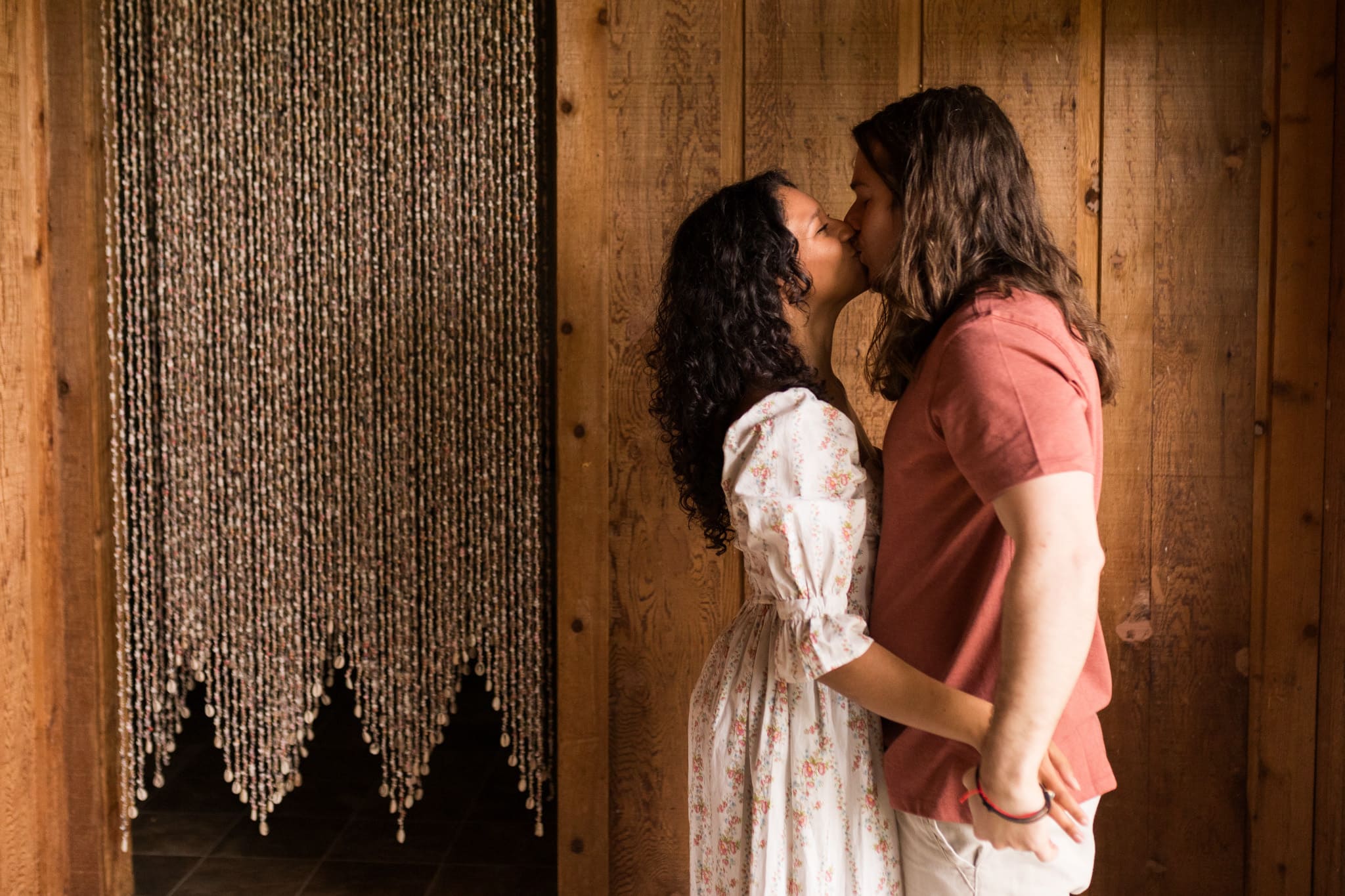 Photo of Adam and Destiny kissing for their engagement photos